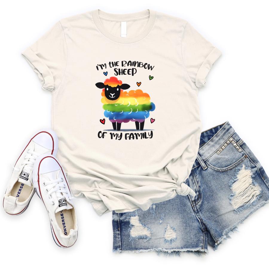 Rainbow Sheep T-Shirt with colorful graphic and text "I'm the Rainbow Sheep of my Family" paired with denim shorts and white sneakers