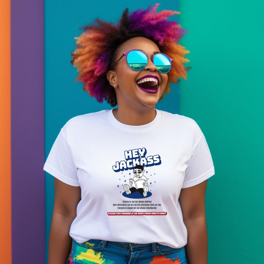 Person wearing colorful hair and reflective sunglasses with a white Hey Jackass T-shirt featuring bold graphic and text design against vibrant green and purple background
