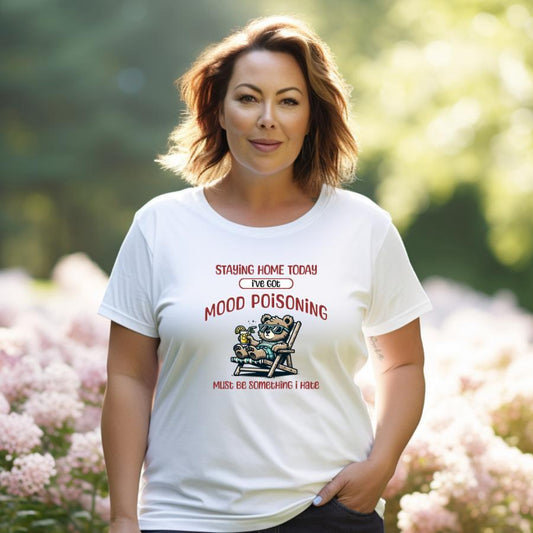 Woman wearing white Mood Poisoning T-Shirt with lounging bear graphic outdoors