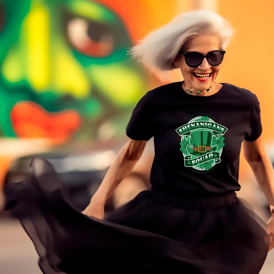 Woman wearing black Shenanigans Squad T-Shirt with St. Patrick's Day themed design smiling and spinning outdoors